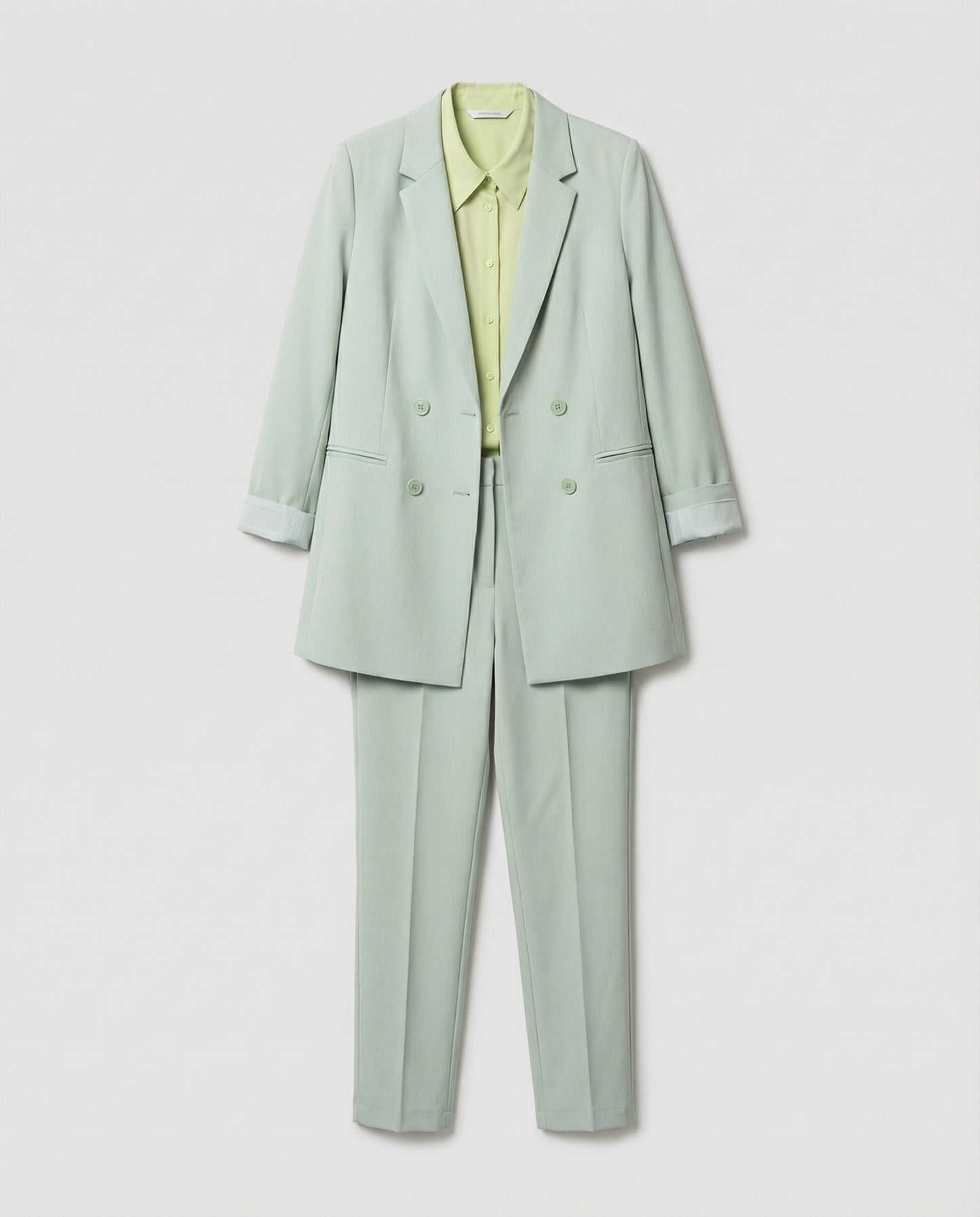 Light green suit with a shirt on a white background