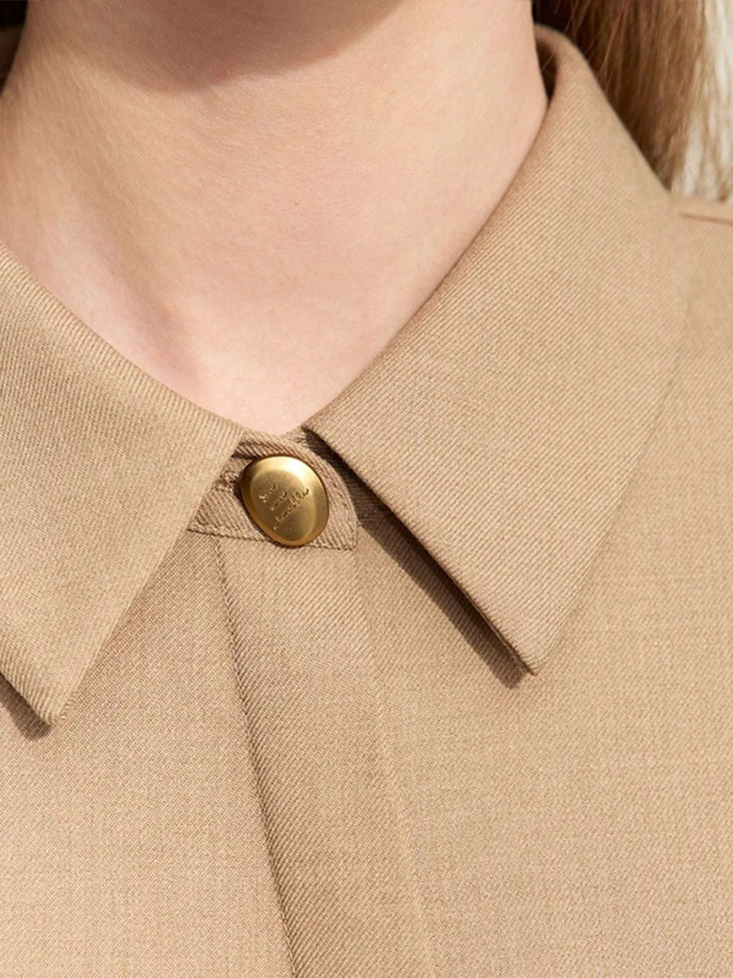 Close-up of beige midi shirt dress fabric texture and belt detail