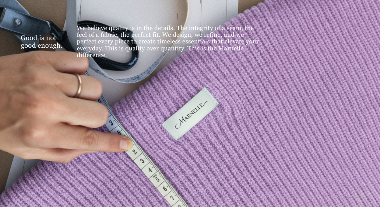 Person measuring pink fabric with a ruler, featuring a label on the fabric.