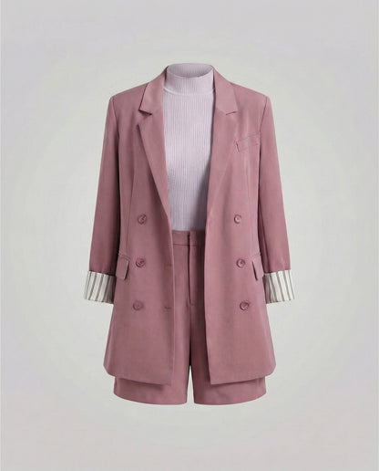 Pink blazer and shorts set on a light gray background