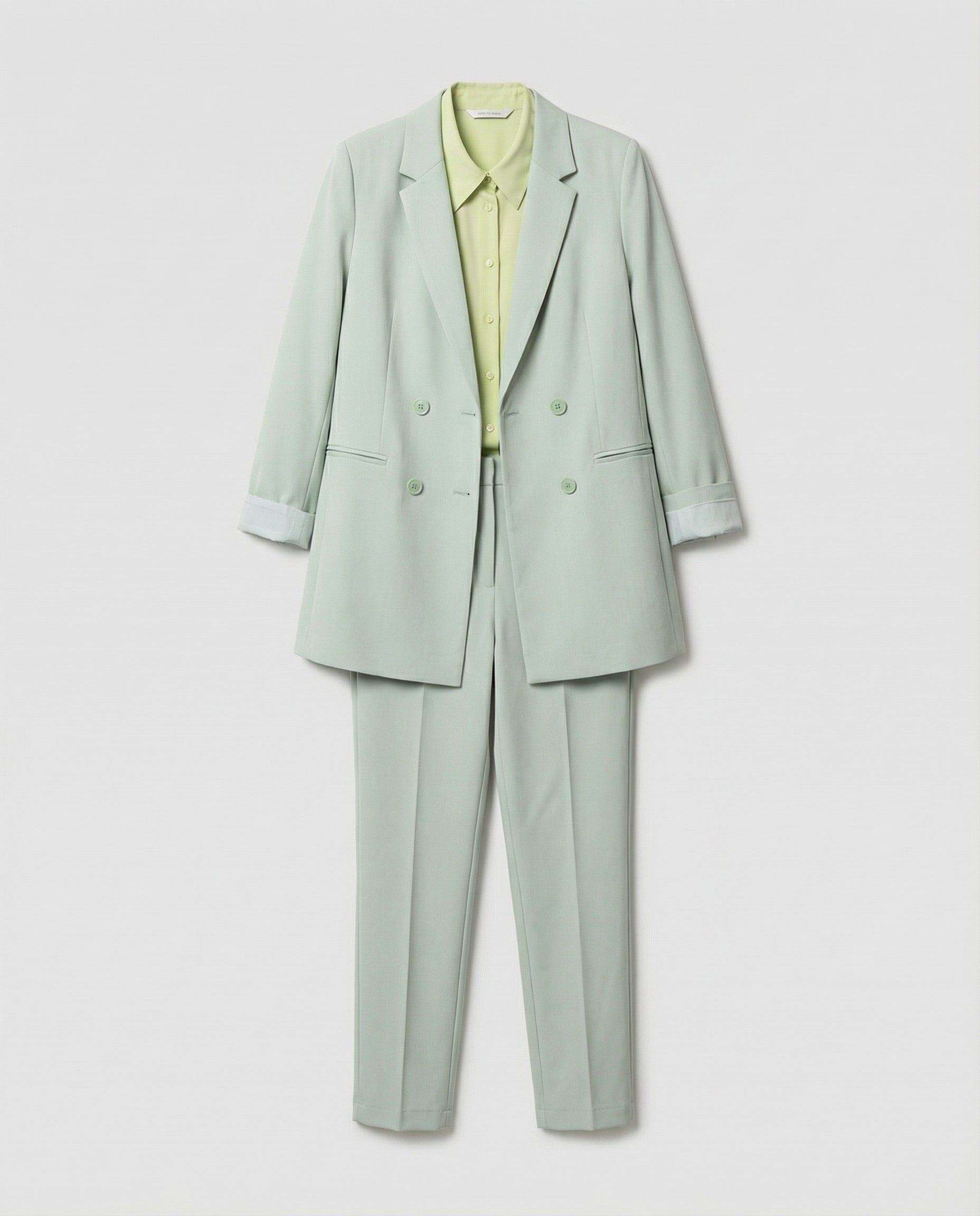 Light green suit with a shirt on a white background