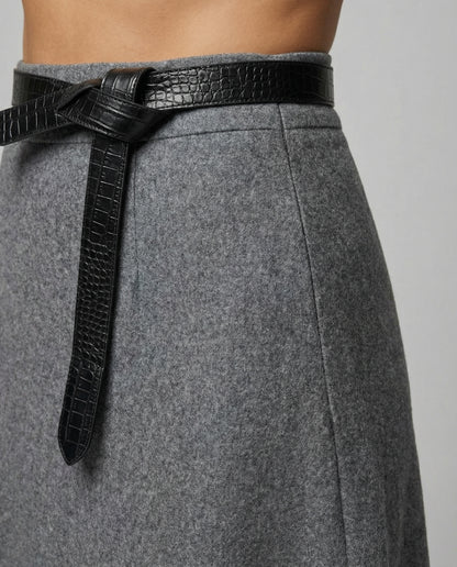 Gray skirt with a black belt on a neutral background