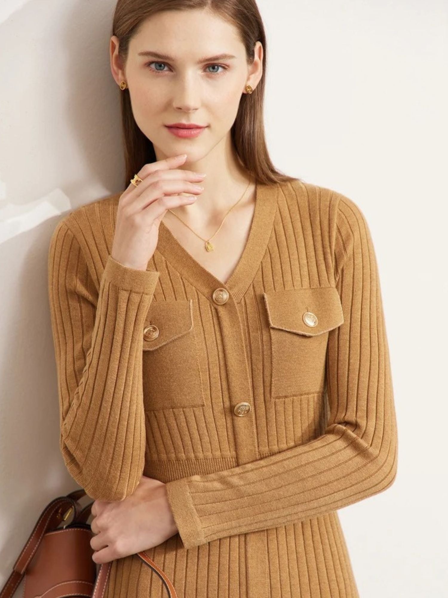 Close-up of camel ribbed knit midi dress chest and button details