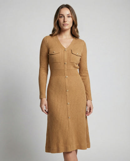Woman wearing a brown ribbed dress with button details on a plain background