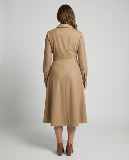 Woman wearing a beige trench coat on a plain background