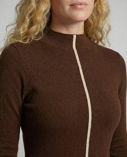 Brown long-sleeve top with a white zipper detail on a neutral background
